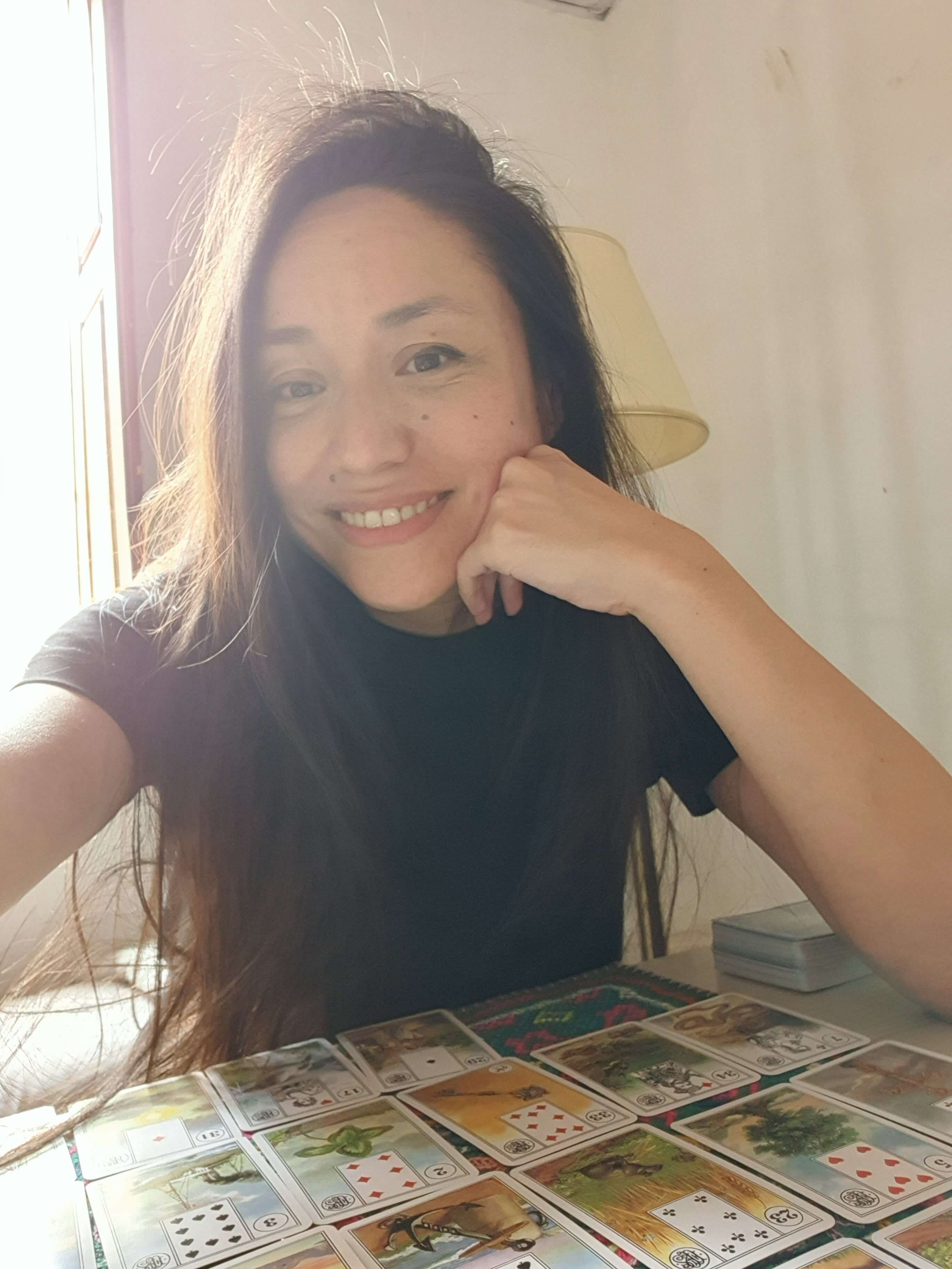 Isabelle, Lenormand and Tarot reader in Barcelona, welcoming visitors to a meaningful local experience